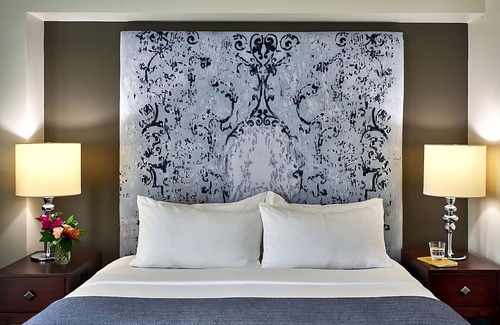 West Plaza Hotel | Enjoy a Pet-Friendly Getaway with Pool Access!