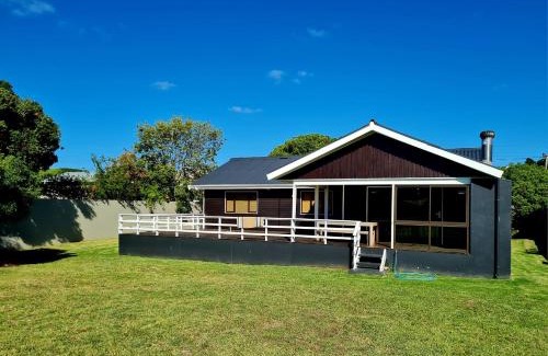 Still Bay House | Charming Riverfront Escape: A Rickety River House Awaits