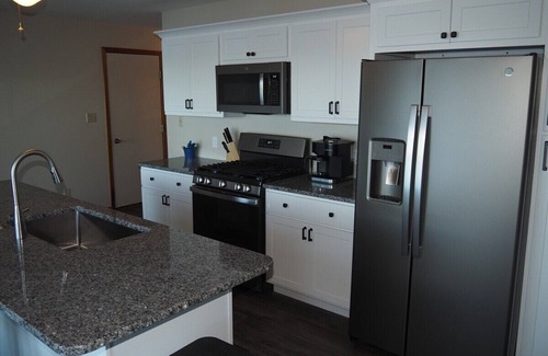 Elk Rapids Cottage | Experience Sandy Lakefront Bliss with Spa and Kayaks