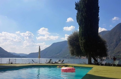 Faggeto Lario Apartment | Superior Comfort at Interhome: Oceanfront Escape Awaits