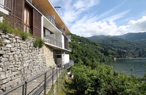 Faggeto Lario Apartment | Superior Comfort at Interhome: Oceanfront Escape Awaits