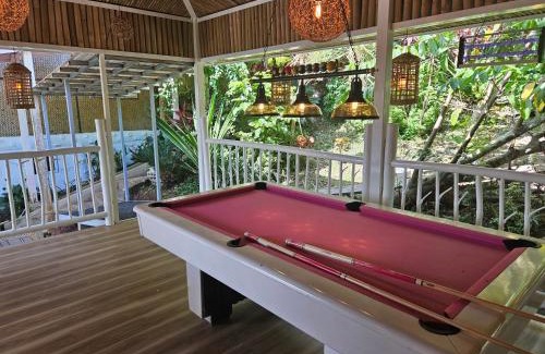 Puerto Princesa Apartment | Discover A Touch of Pink: Oceanfront Garden Retreat