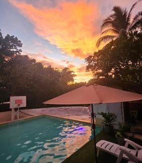 Puerto Princesa Apartment | Discover A Touch of Pink: Oceanfront Garden Retreat