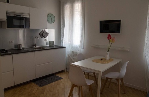 Case Peschiera-Lu Fraili Apartment | Enjoy Modern Comforts with a Flat-Screen TV in Your Room
