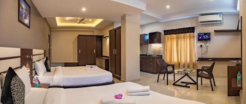 Vijayanagar Hotel | Experience Comfort at Aadya Elite with Breakfast Included