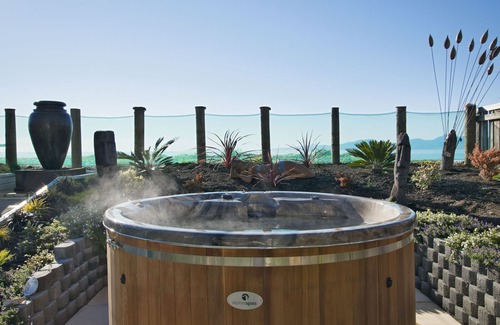 Ruby Bay House | Beachfront Haven: Sea Views, Hot Tub & Top Guest Rating