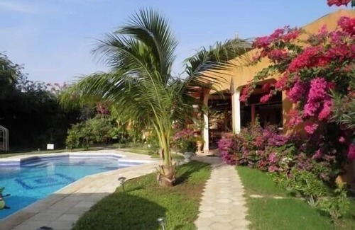 Mbour House | Inviting African Hut Retreat with Pool & Ocean Views