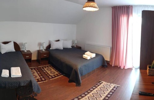 Cupseni Villa | Discover Agropensiunea Pe Poderei with Cozy Fireplace