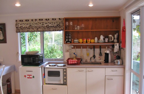 Okiato Apartment | Serene Aimeo Iti Studio: Garden Oasis Near Beach & Town