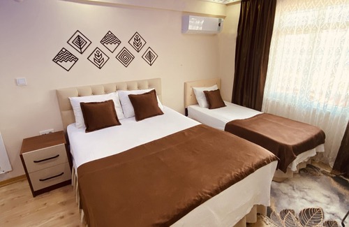 Karaburun Koyu Hotel | Convenient Stay at Airport Kumsal Otel with Family Amenities