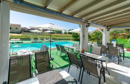 Agios Georgios Pagon Apartment | Inviting Akis Villa Studios & Apartment with Pool and Ocean View