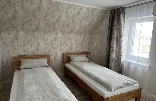 Siauliai County Apartment | Family-Friendly Akmerenta - Kadagių dvarelis with High Ratings