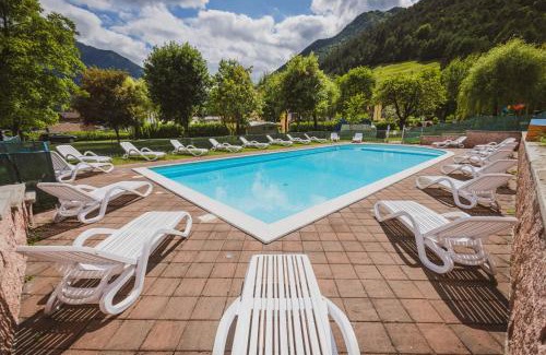Tiarno di Sopra Bed & Breakfast | Discover Albergo Casavecchia: Beachfront Oasis with Pool