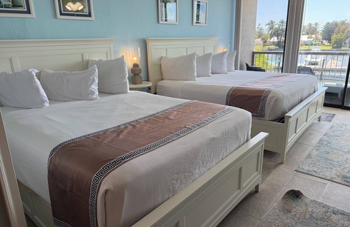 Trailer Estates Hotel | Modern Waterfront Retreat with Balcony, Pool & Tiki Bar