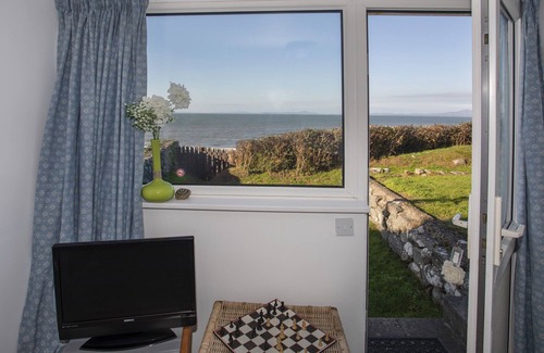 Llanfair Cottage | Discover Allt y Mor: Oceanfront Retreat with Family-Friendly Amenities