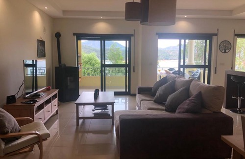Aguas Belas Apartment | Tranquil Stay by the Lake Near Zêzere with Ocean View