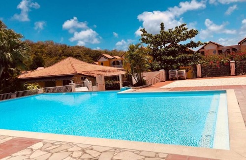 Sainte-Anne Apartment | Discover Comfort at ALPINIA972: Pool, Spa & Family Fun