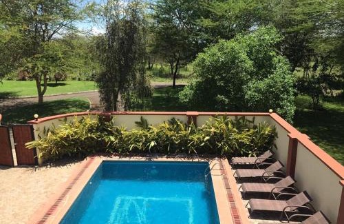 Arusha Hotel | Discover Amani Villa: Family-Friendly Stay with Pool & Dining
