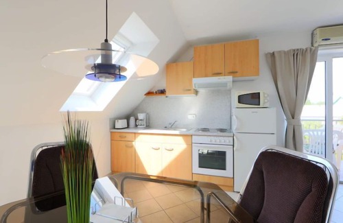 Balatonmariafurdo Apartment | Cozy Amarillo 3: Oceanfront Bliss with Pool Access