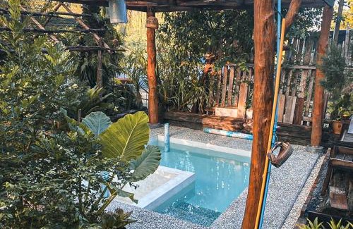 Huai Nam Khao House | Relax at Amarit Onsen Homestay with Inviting Hot Tub