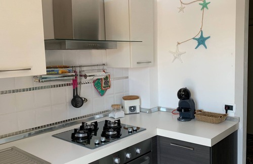 Follonica Apartment | Cozy Beachfront Apartment with Ocean View & Breakfast