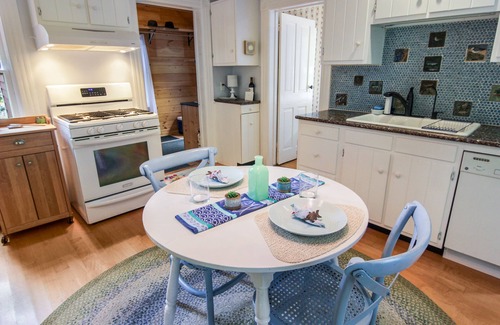 Leland House | Cozy Cottage in Leland Village - Steps to Beaches & Sunsets