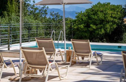 Perama Apartment | Experience AMD House: Oceanfront Retreat with Pool Access