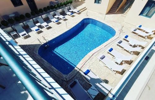 Mytikas Apartment | Explore Anemos Villas: Oceanfront Bliss with Pool & Hot Tub
