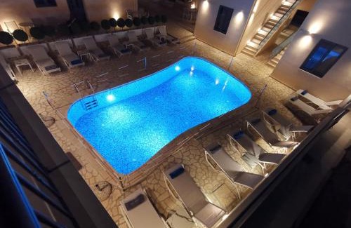 Mytikas Apartment | Explore Anemos Villas: Oceanfront Bliss with Pool & Hot Tub