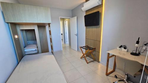 Vila Anhanguera Apartment | Oceanfront Escape with Air Conditioning and Gourmet Balcony