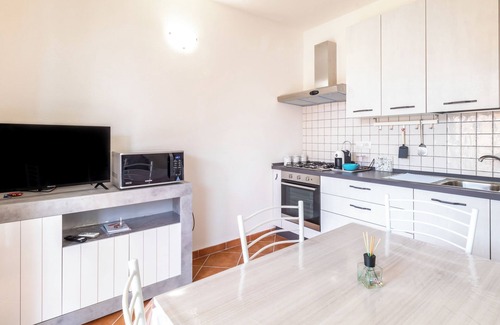 Trinita d'Agultu Apartment | Oceanfront Apartment 'Green Garden F1' with Pool & Wi-Fi
