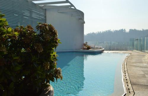 Providencia Apartment | Family-Friendly Apart Lyon Suite with Oceanfront Pool