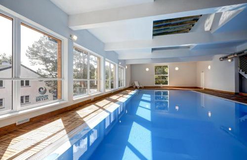 Poddabie Apartment | Inviting 4-Star Blue Marine Poddąbie with Pools & Fun