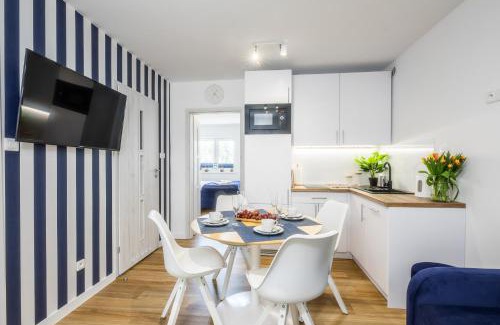 Poddabie Apartment | Inviting 4-Star Blue Marine Poddąbie with Pools & Fun