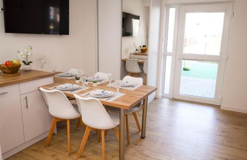 Poddabie Apartment | Experience Blue Marine Poddąbie: Poolside Family Retreat
