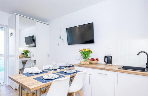 Poddabie Apartment | Oceanfront Retreat: 4-Star Blue Marine Poddąbie Apartment
