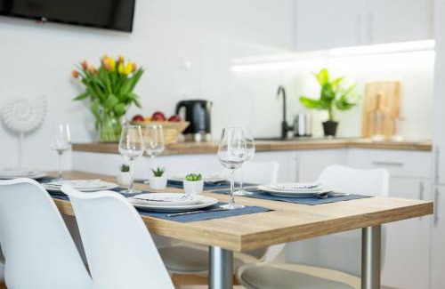 Poddabie Apartment | Oceanfront Retreat: 4-Star Blue Marine Poddąbie Apartment