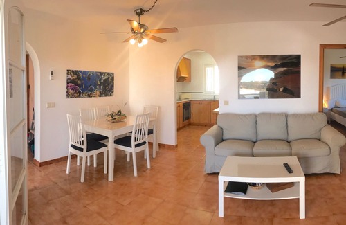 Arenal d'en Castell Apartment | Oceanfront Apartment with Pool and Stunning Sea Views