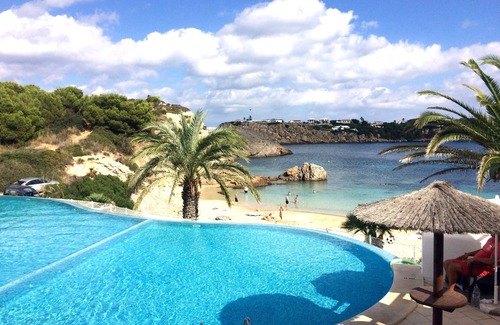 Arenal d'en Castell Apartment | Oceanfront Apartment with Pool and Stunning Sea Views