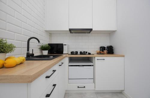 Zoliborz Apartment | Cozy One-Bedroom Apartment with Balcony Near Metro