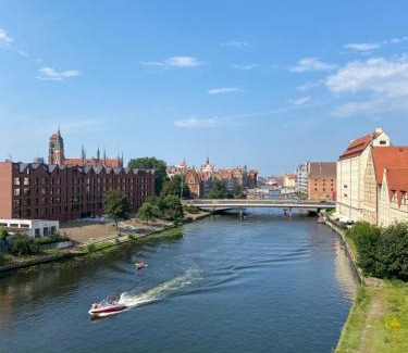 Old Town Apartment | Discover a Poolside Retreat with Motława Views