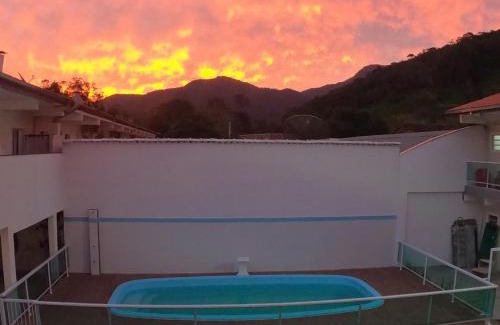 Maranduba Apartment | Experience a Poolside Retreat with Ocean Views and BBQ