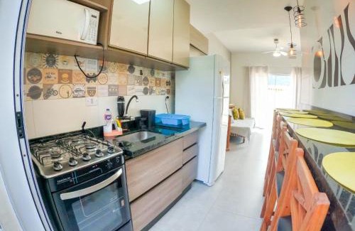 Maranduba Apartment | Experience a Poolside Retreat with Ocean Views and BBQ