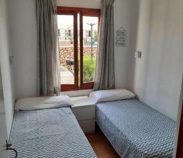 Arenal d'en Castell Apartment | Beachside Apartment in Arenal with Pool and Ocean Views
