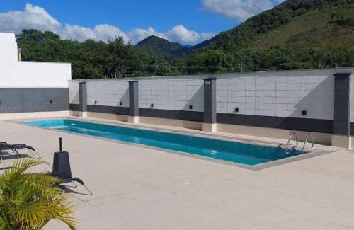 Centro Apartment | Experience Ubatuba: Central Apartment with Ocean View & Charcoal Grill