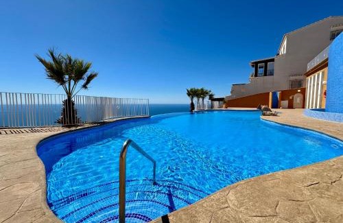 Cumbre del Sol Apartment | Panorama X0089: Family-Friendly Retreat with Pool Access