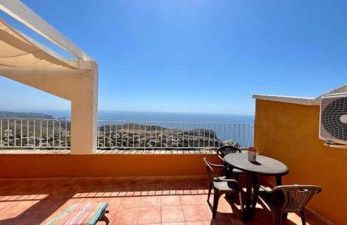 Cumbre del Sol Apartment | Panorama X0089: Family-Friendly Retreat with Pool Access