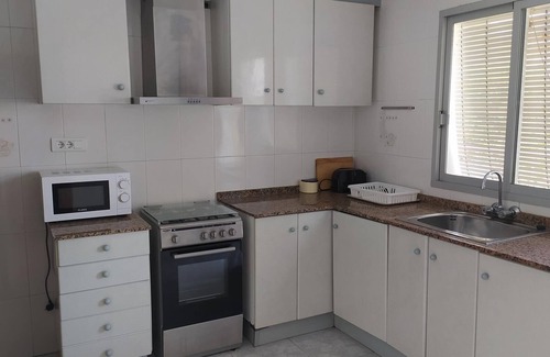 Oliva Apartment | Family-Friendly Apartment Steps from Oliva Playa Beach