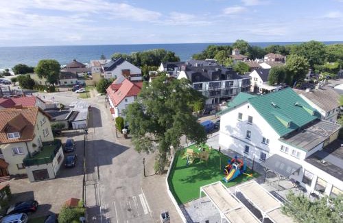 Niechorze Hotel | Oceanfront Retreat at Apartamenty Makadamia - Guest Rated 9.9