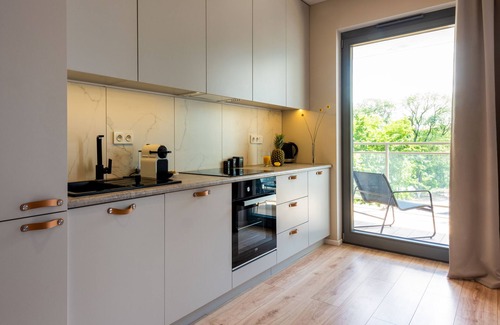 Srodmiescie Apartment | Discover River Point: 4-Star Apartment with Great Amenities